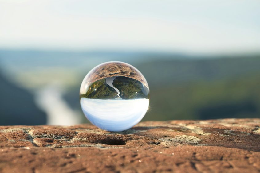 clear marble on brown rock
