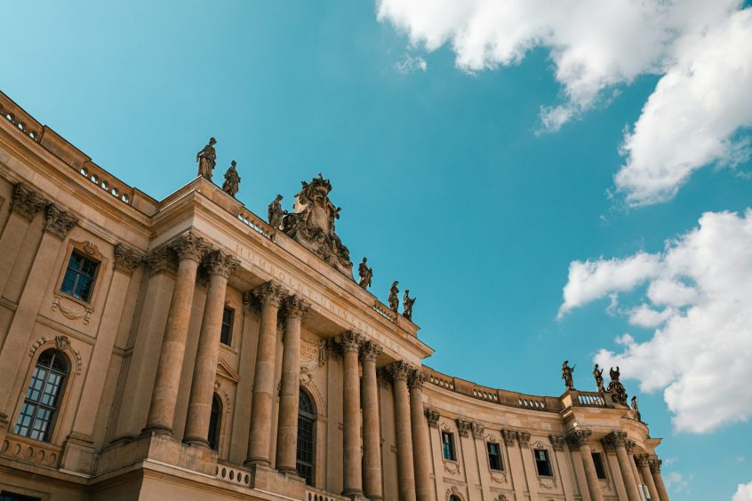 a large building with statues on top of it